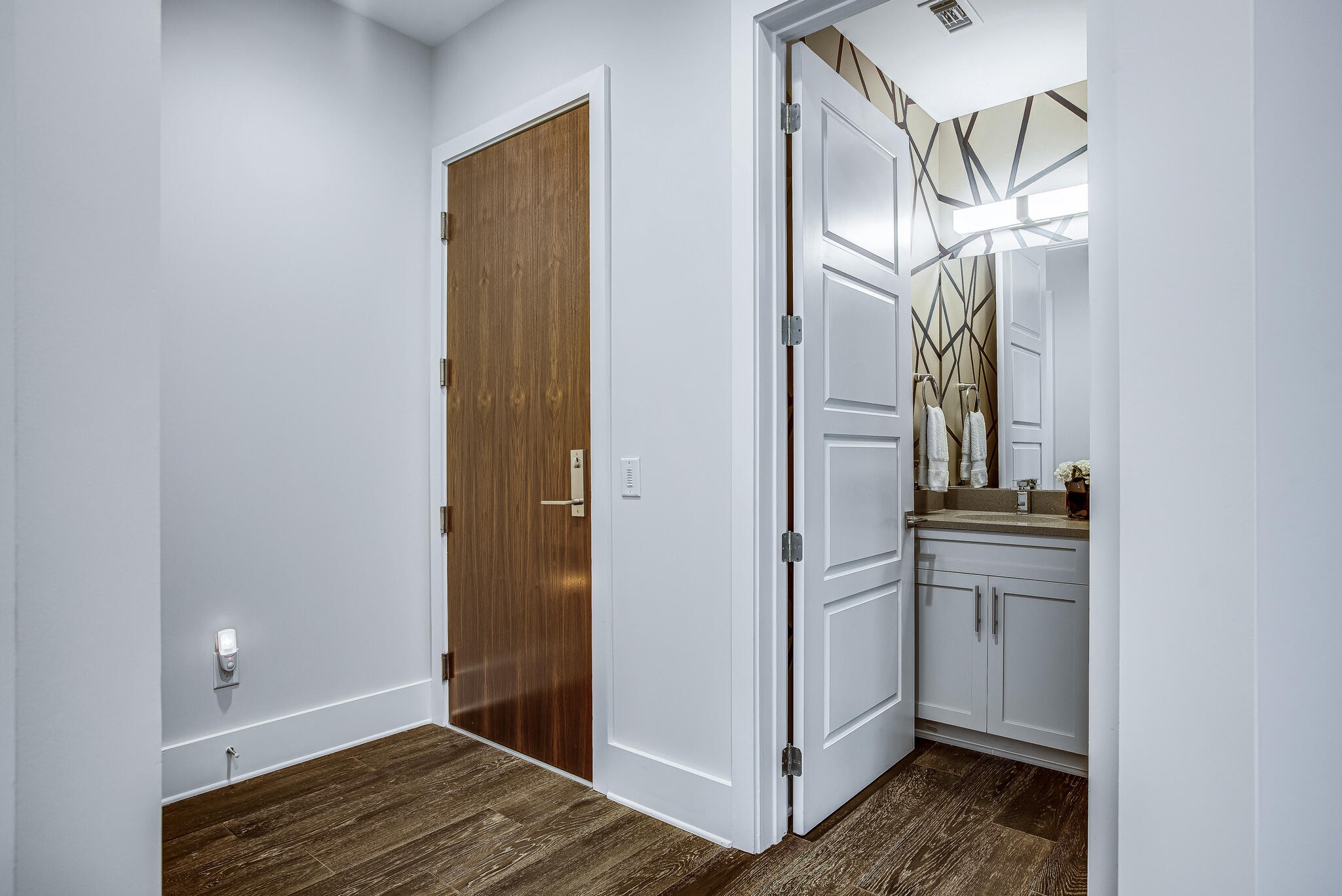 20 Rutledge Street, Unit 407 Nashville, TN 37210 - Photo 3 of 39 a view of a kitchen from the hallway