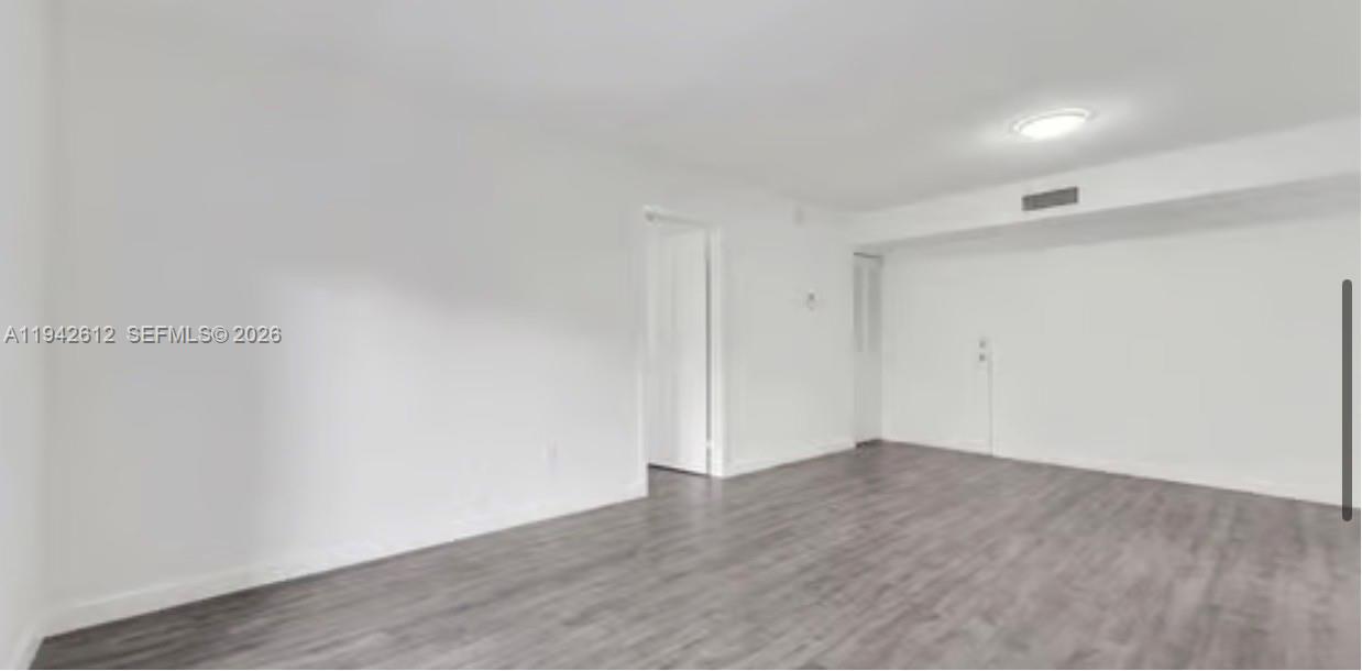 4841 Northwest 7th Street, Unit 3034 Miami, FL 33126 - Photo 16 of 35 a view of an empty room