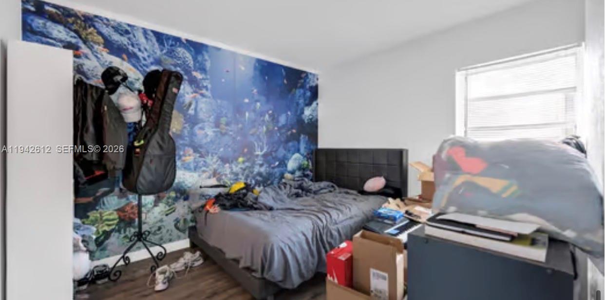 4841 Northwest 7th Street, Unit 3034 Miami, FL 33126 - Photo 19 of 35 a living room with furniture and a fireplace