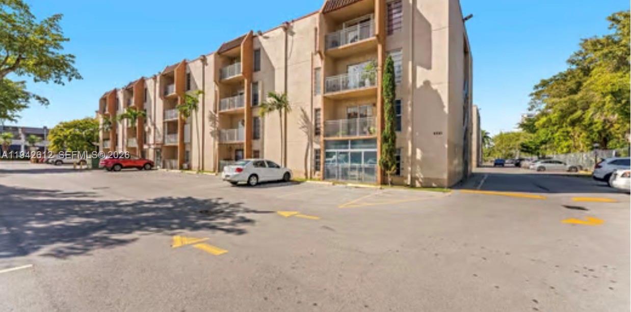 4841 Northwest 7th Street, Unit 3034 Miami, FL 33126 - Photo 2 of 35 a view of street with tall buildings