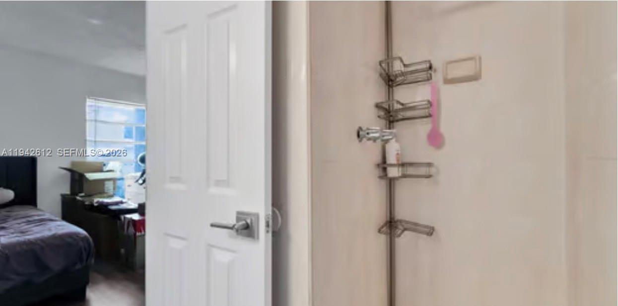 4841 Northwest 7th Street, Unit 3034 Miami, FL 33126 - Photo 26 of 35 a bathroom with a shower