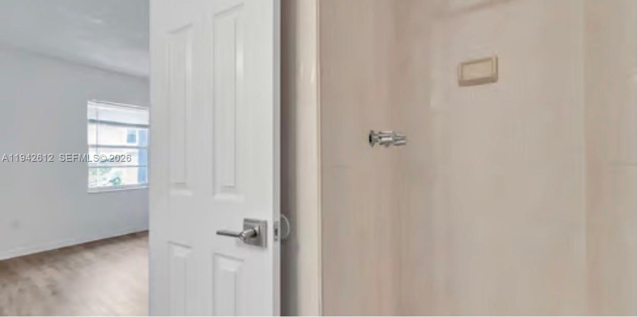 4841 Northwest 7th Street, Unit 3034 Miami, FL 33126 - Photo 29 of 35 a bathroom with a shower