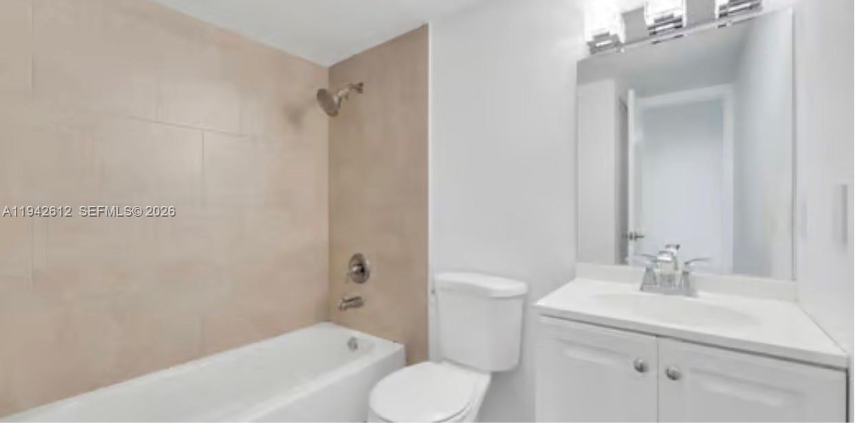 4841 Northwest 7th Street, Unit 3034 Miami, FL 33126 - Photo 32 of 35 a bathroom with a sink toilet and shower