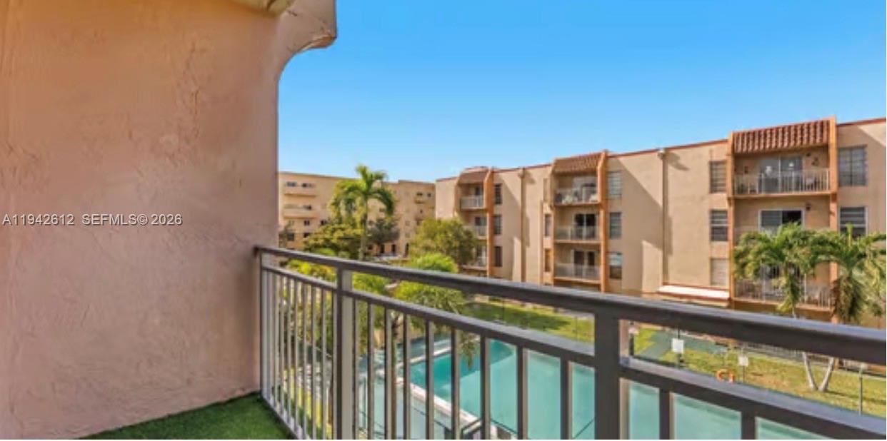 4841 Northwest 7th Street, Unit 3034 Miami, FL 33126 - Photo 34 of 35 a view of a building from a balcony