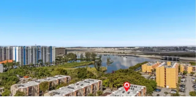 a view of a lake with a building in front of it
