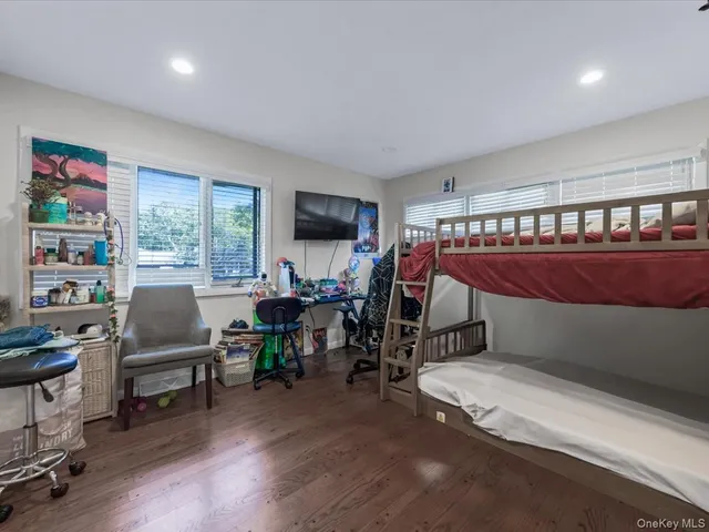 a bedroom with furniture and a window