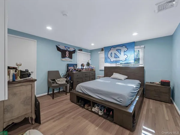 a bed room with a bed and furniture