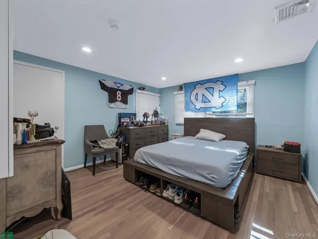 a bed room with a bed and furniture