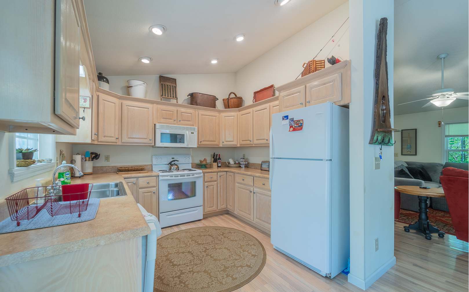 64 Driver Avenue Murphy, NC 28906 - Photo 4 of 4 a kitchen with a refrigerator a stove and wooden cabinets