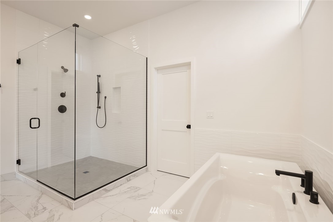23521 7th Avenue Southeast Bothell, WA 98021 - Photo 11 of 27 a bathroom with a shower and a sink
