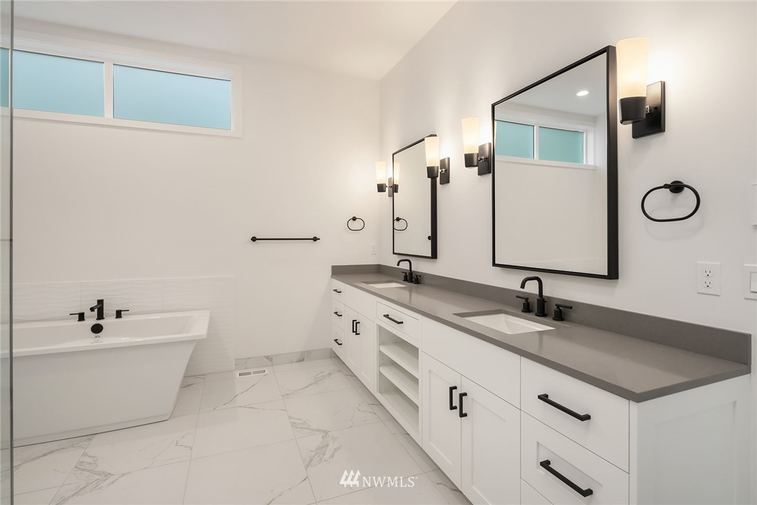 23521 7th Avenue Southeast Bothell, WA 98021 - Photo 12 of 27 a bathroom with a double vanity sink and a mirror