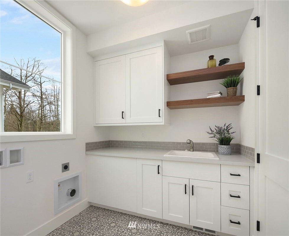 23521 7th Avenue Southeast Bothell, WA 98021 - Photo 13 of 27 a kitchen with cabinets and window