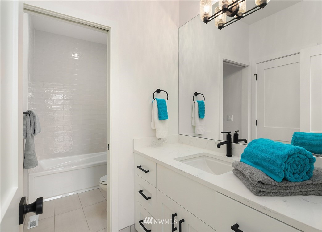 23521 7th Avenue Southeast Bothell, WA 98021 - Photo 19 of 27 a bathroom with a sink and a mirror