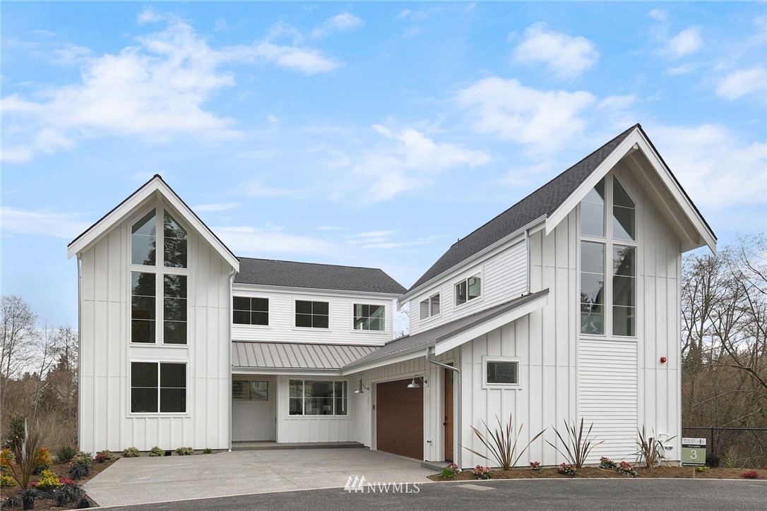23521 7th Avenue Southeast Bothell, WA 98021 - Photo 24 of 27 a view of a white house with large windows