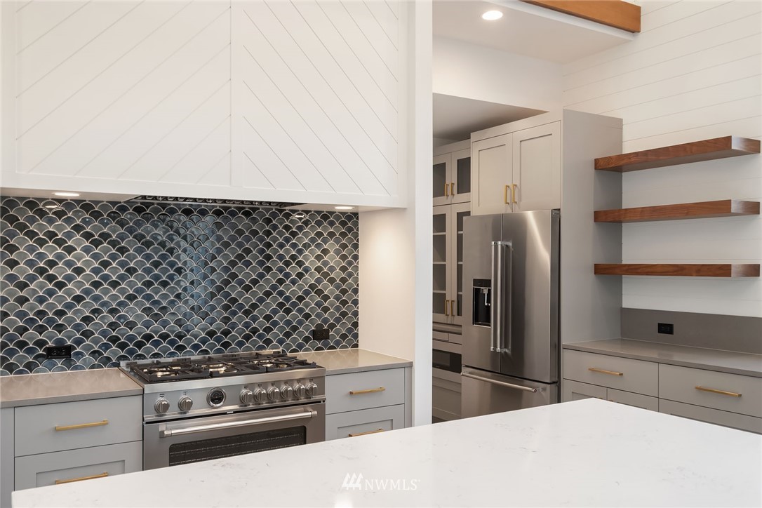 23521 7th Avenue Southeast Bothell, WA 98021 - Photo 27 of 27 a kitchen with a refrigerator stove and cabinets