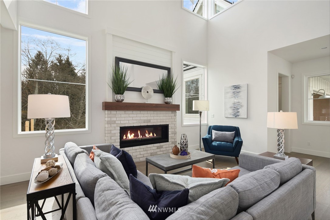 23521 7th Avenue Southeast Bothell, WA 98021 - Photo 8 of 27 a living room with furniture and a fireplace