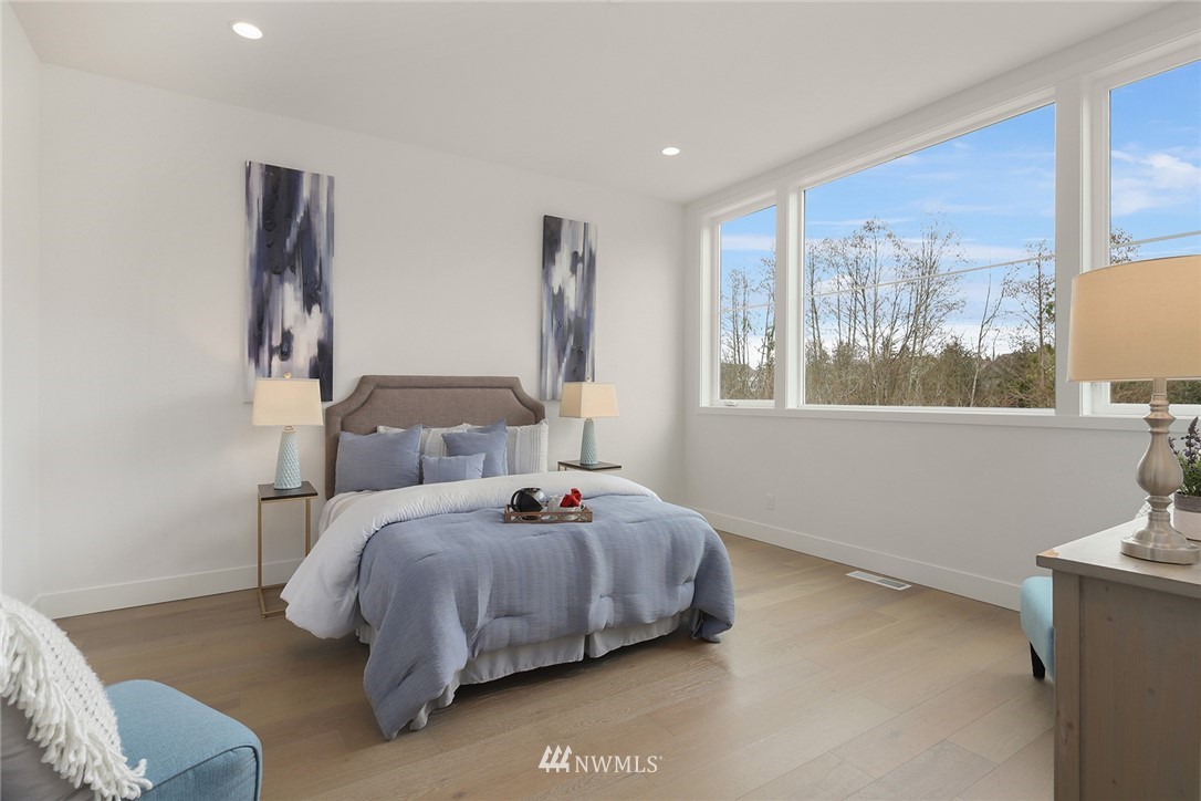 23521 7th Avenue Southeast Bothell, WA 98021 - Photo 9 of 27 a bedroom with a bed and window