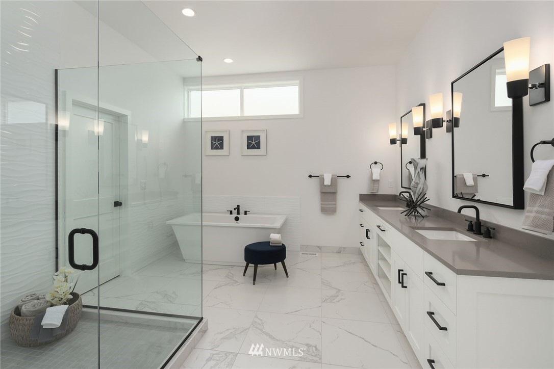 23521 7th Avenue Southeast Bothell, WA 98021 - Photo 10 of 27 a spacious bathroom with double vanity sinks and a mirror