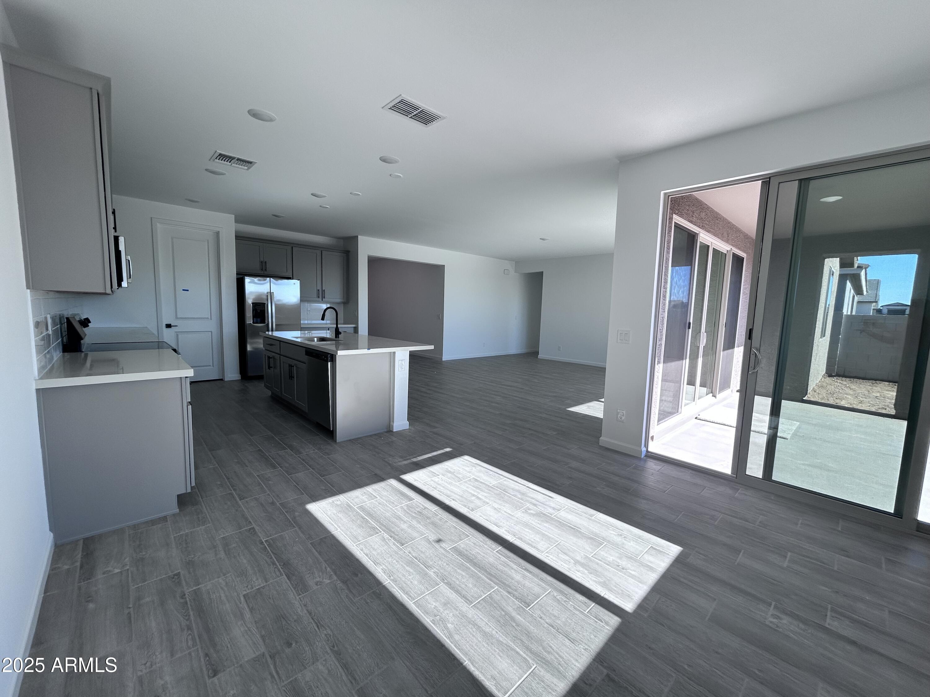 2603 Rustler Road San Tan Valley, AZ 85140 - Photo 12 of 34 a living room with furniture and a wooden floor
