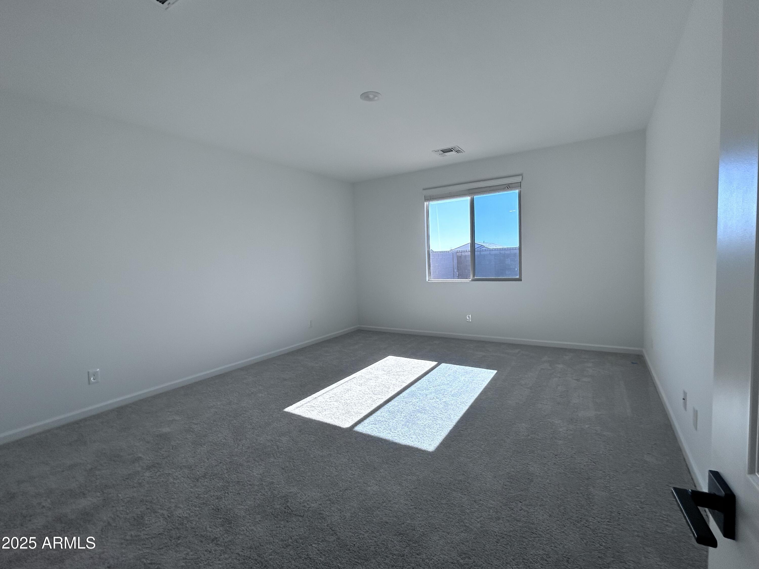 2603 Rustler Road San Tan Valley, AZ 85140 - Photo 14 of 34 an empty room with a window
