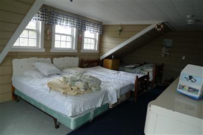 35 South Sunken Meadow Road Eastham, MA 02642 - Photo 14 of 22 a bedroom with a bed and window