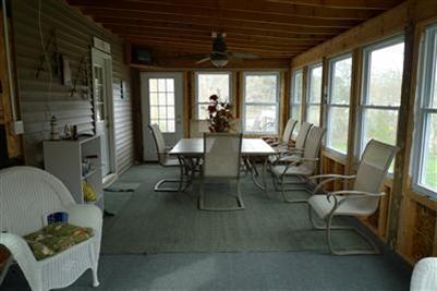 35 South Sunken Meadow Road Eastham, MA 02642 - Photo 16 of 22 a view of a dining room with furniture window and outside view