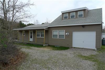 35 South Sunken Meadow Road Eastham, MA 02642 - Photo 19 of 22 a view of a house with a yard