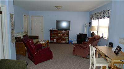 35 South Sunken Meadow Road Eastham, MA 02642 - Photo 5 of 22 a living room with furniture and a flat screen tv
