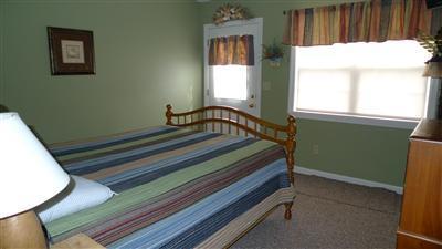 35 South Sunken Meadow Road Eastham, MA 02642 - Photo 7 of 22 a bedroom with window and a bed