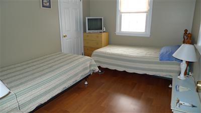 35 South Sunken Meadow Road Eastham, MA 02642 - Photo 9 of 22 a bedroom with a bed and a window