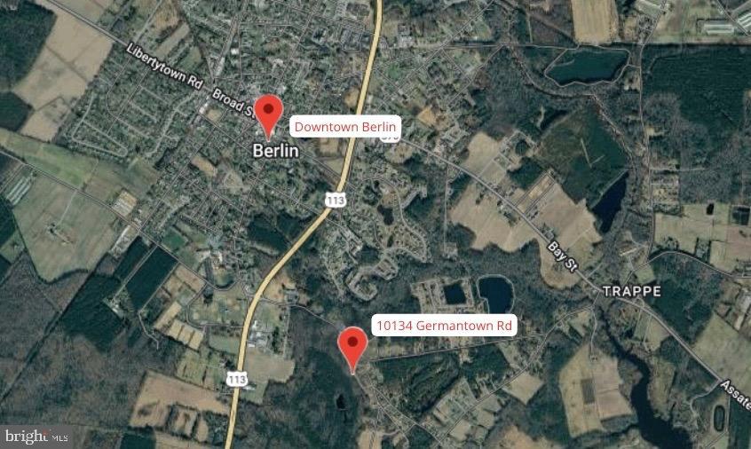 10134 Germantown Road Berlin, MD 21811 - Photo 5 of 6 an aerial view of a house with a yard and outdoor seating