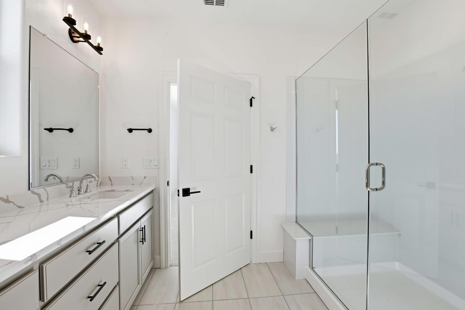 3195 Splendor Drive Lincoln, CA 95648 - Photo 15 of 26 a bathroom with a shower sink vanity and mirror