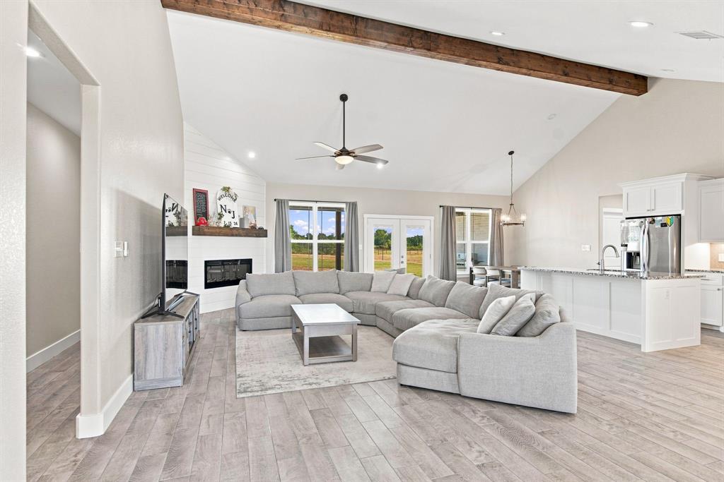 121 Friendship Way Boyd, TX 76023 - Photo 6 of 38 Vaulted ceiling with exposed wood beams