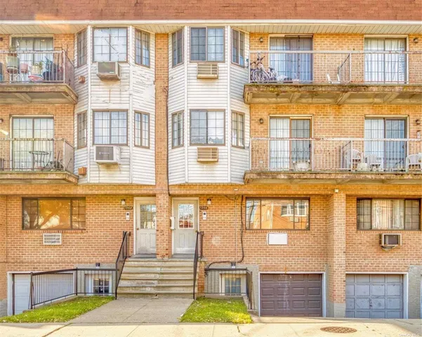 a front view of a building with a swimming pool