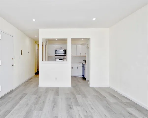 a view of a kitchen with wooden floor