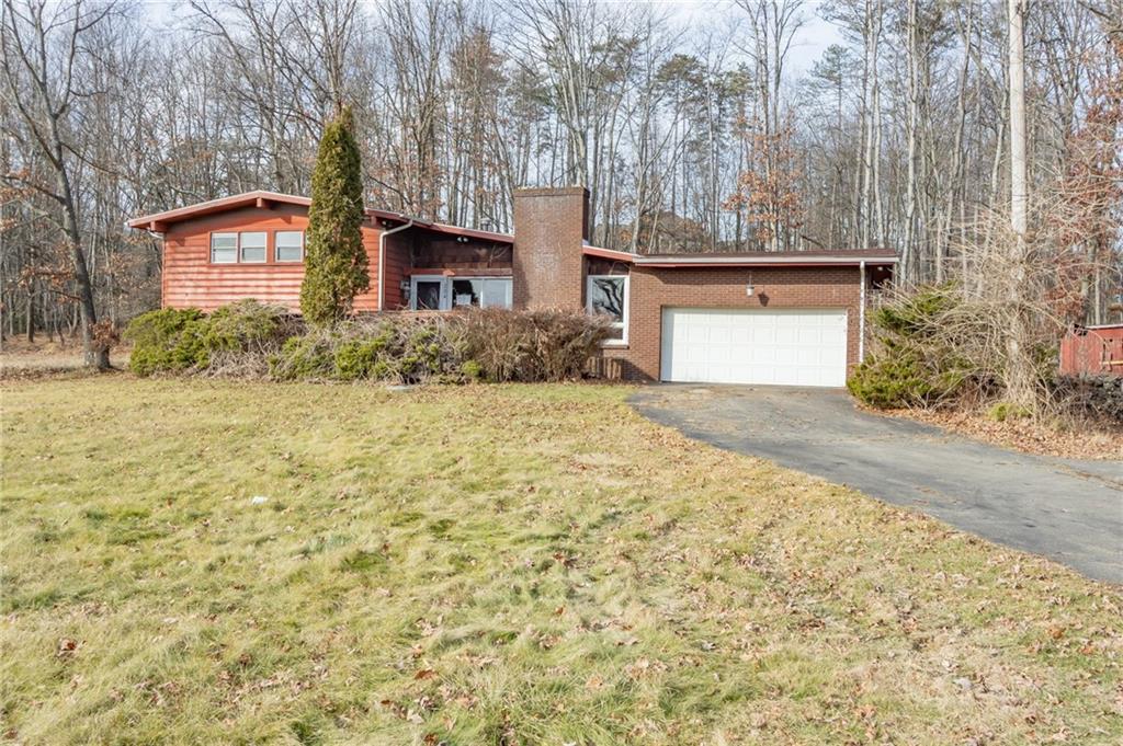 284 Myoma Road Mars, PA 16046 - Photo 3 of 33 a front view of a house with a yard and garage
