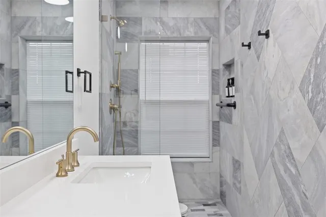 a bathroom with a sink and a shower