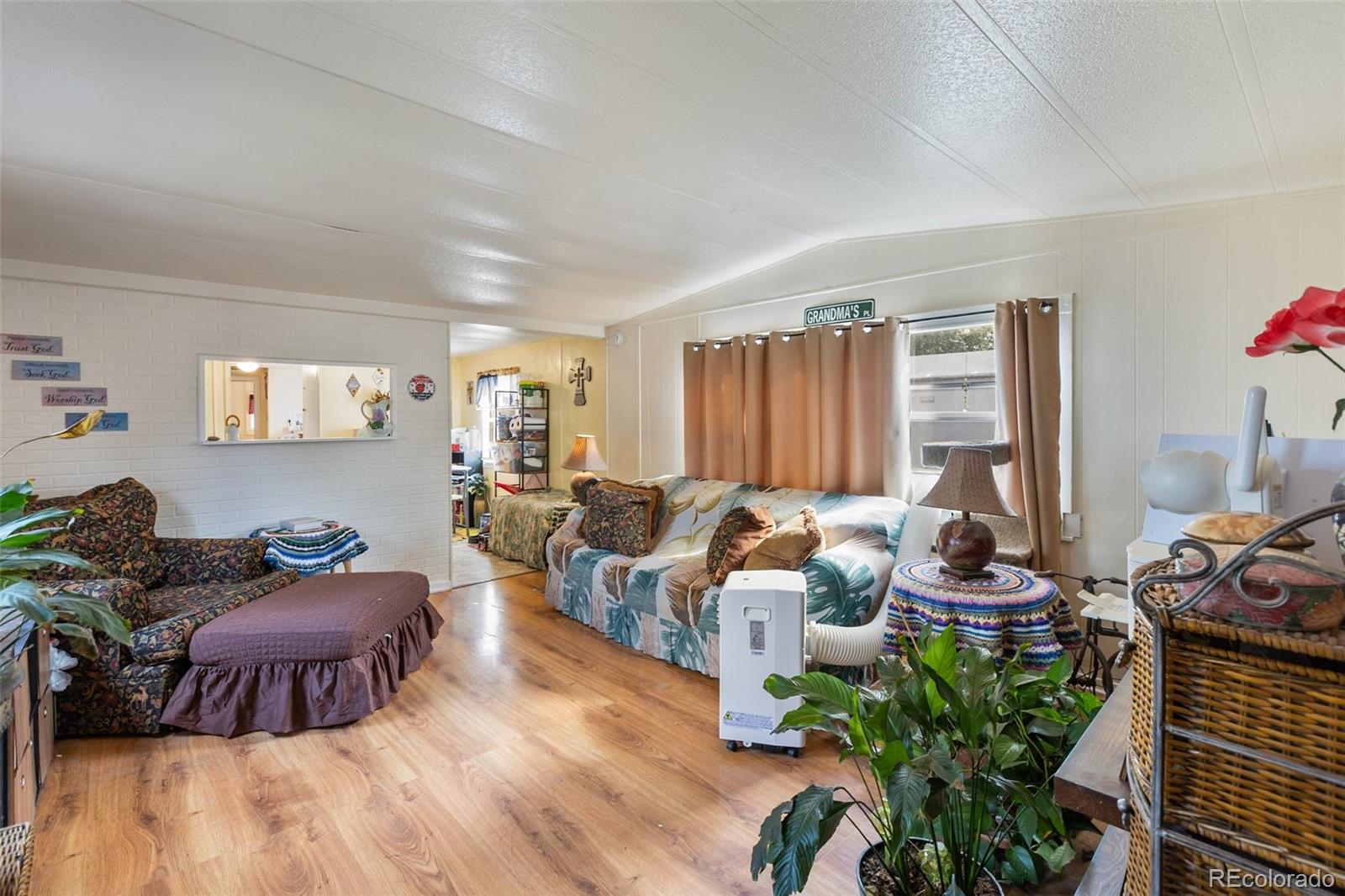 600 Raintree Boulevard, Unit 98 Canon City, CO 81212 - Photo 12 of 25 a living room with furniture fireplace and a large window