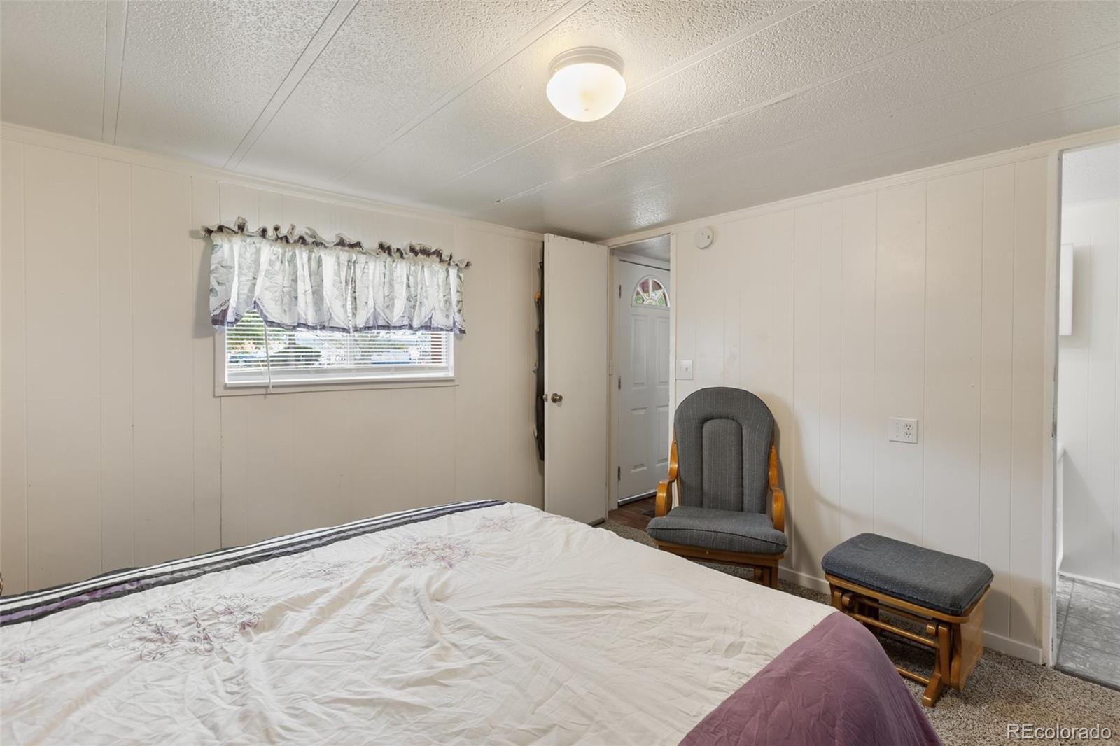 600 Raintree Boulevard, Unit 98 Canon City, CO 81212 - Photo 15 of 25 a bedroom with a bed and a window