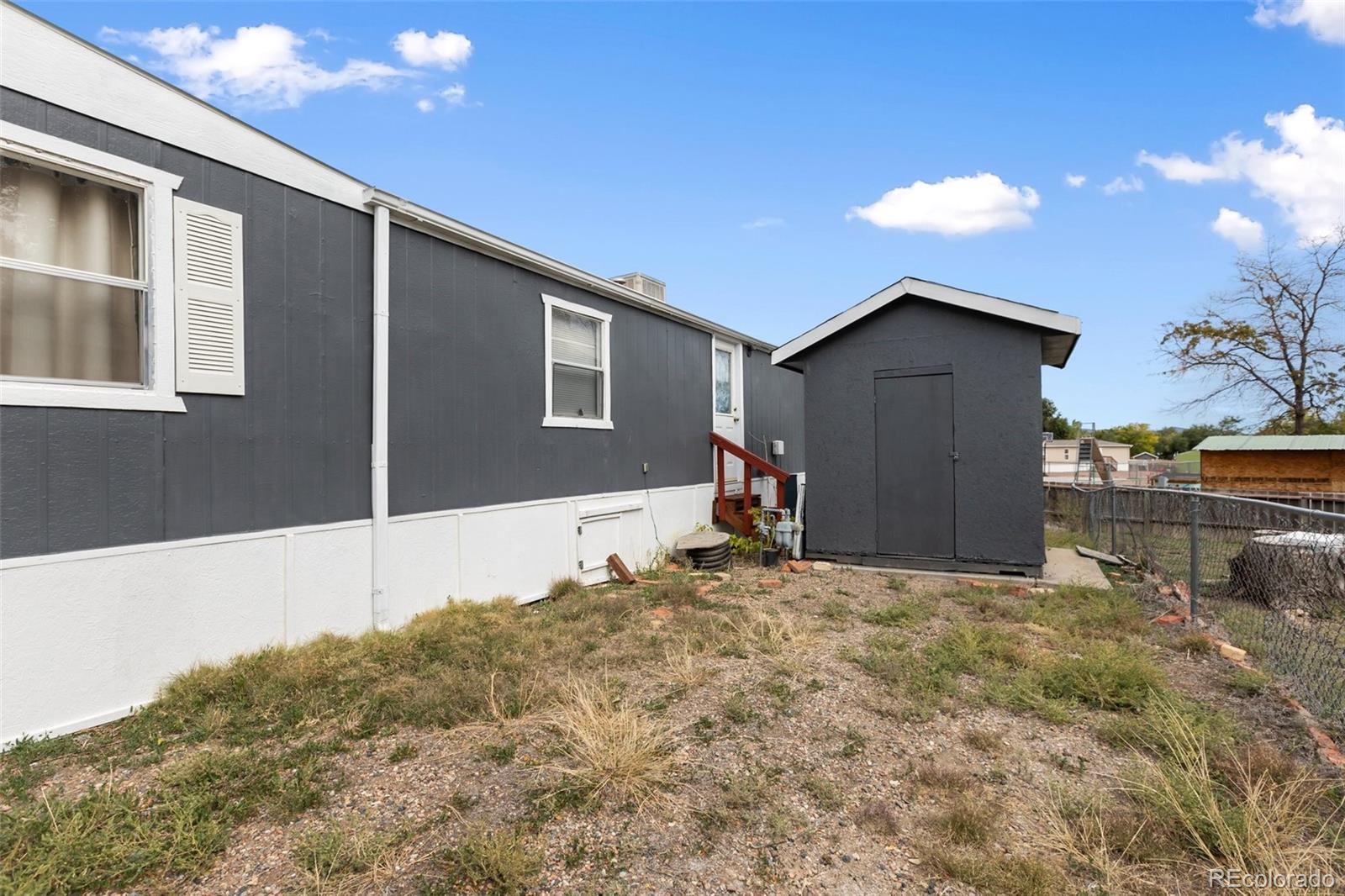 600 Raintree Boulevard, Unit 98 Canon City, CO 81212 - Photo 25 of 25 a view of a house with a backyard
