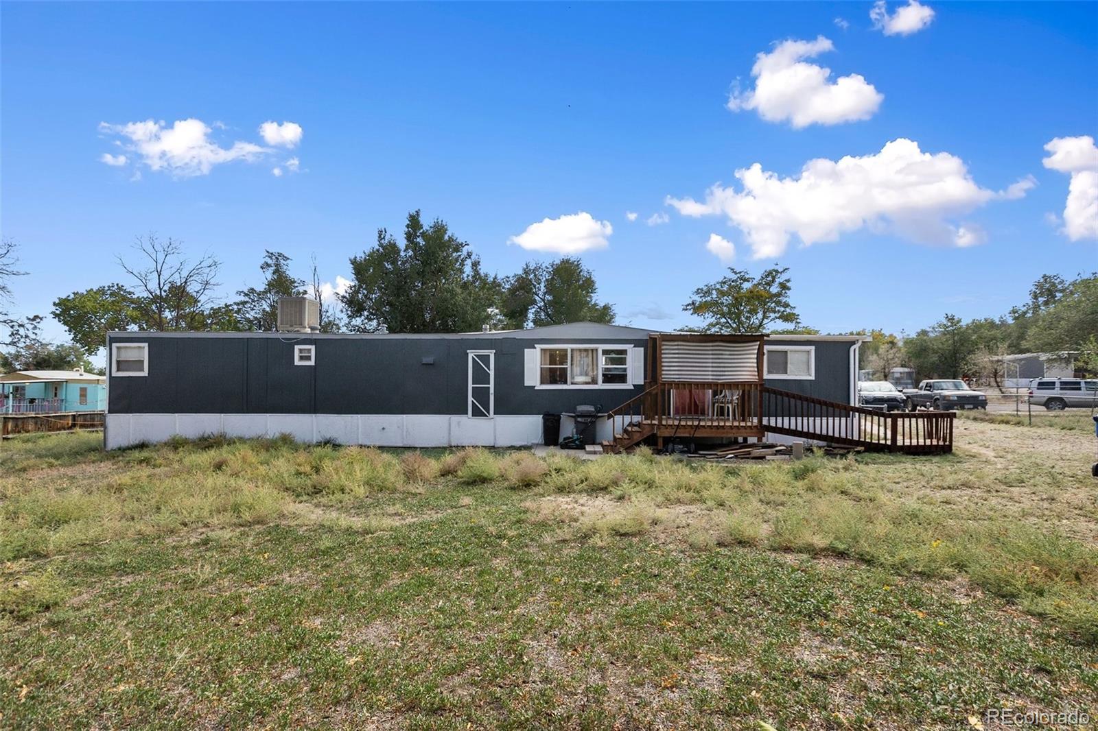600 Raintree Boulevard, Unit 98 Canon City, CO 81212 - Photo 3 of 25 a view of a house with a yard