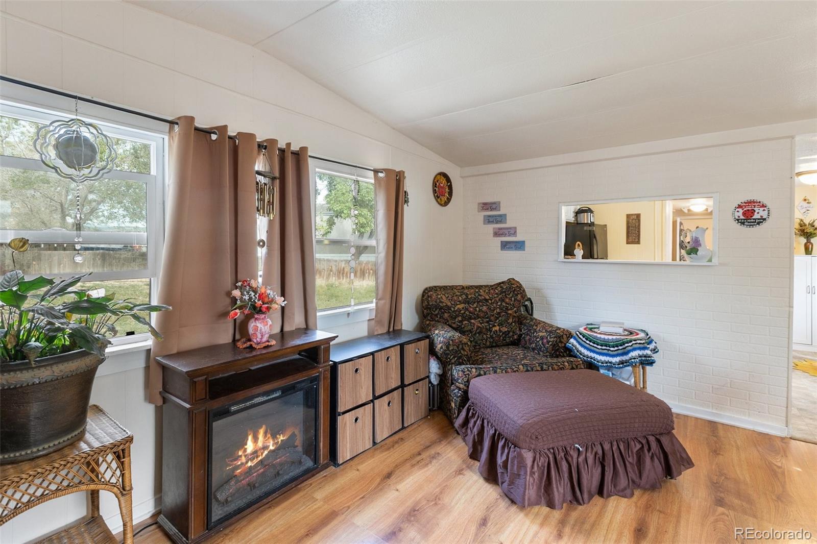 600 Raintree Boulevard, Unit 98 Canon City, CO 81212 - Photo 7 of 25 a living room with furniture and a potted plant