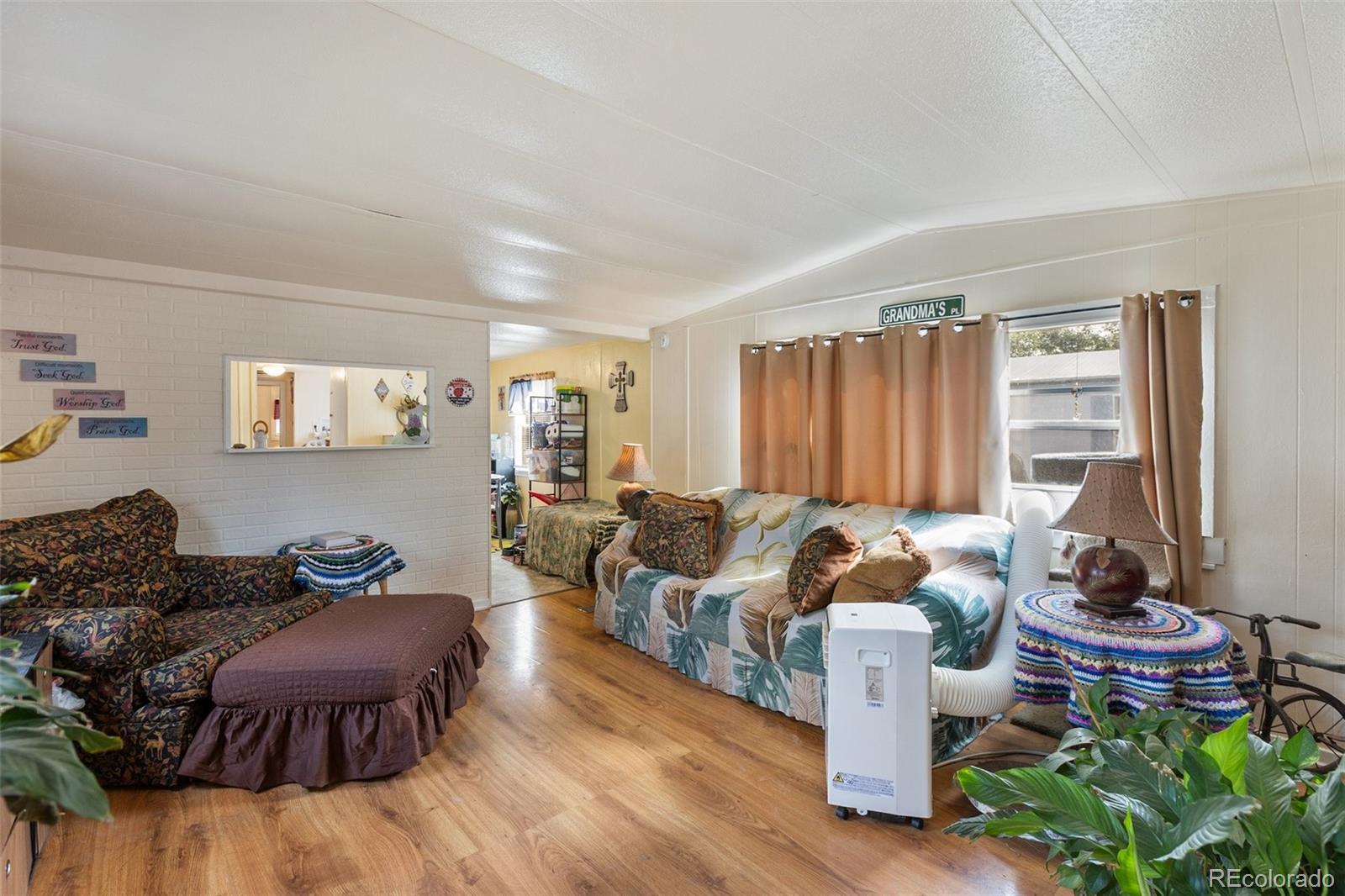 600 Raintree Boulevard, Unit 98 Canon City, CO 81212 - Photo 9 of 25 a living room with furniture and a window
