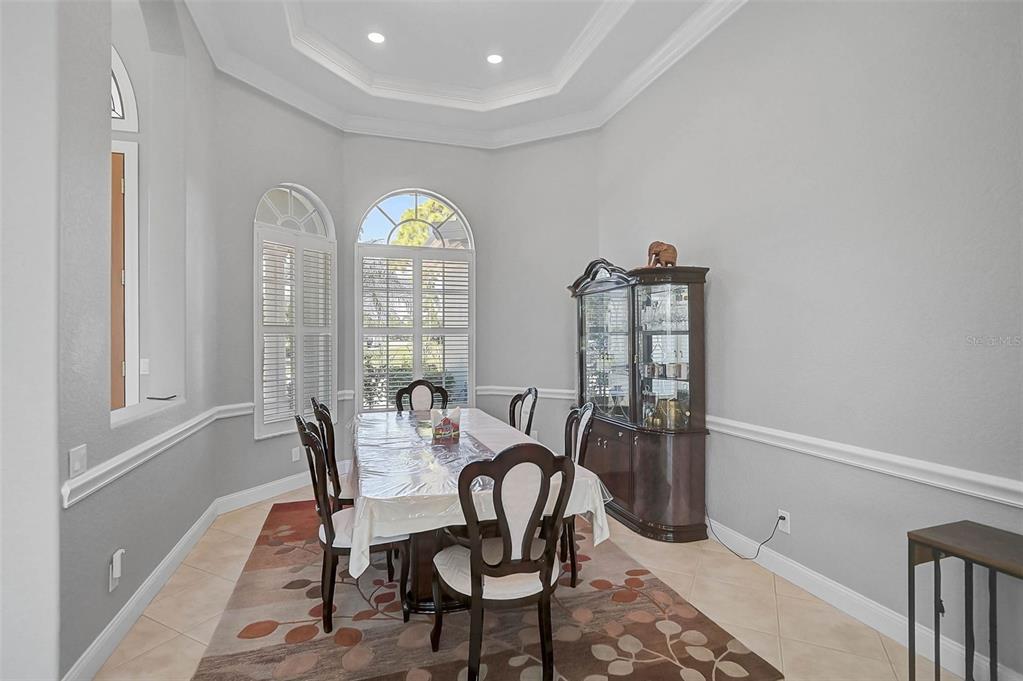 538 Dove Pointe Osprey, FL 34229 - Photo 12 of 74 a view of a dining room with furniture and a window