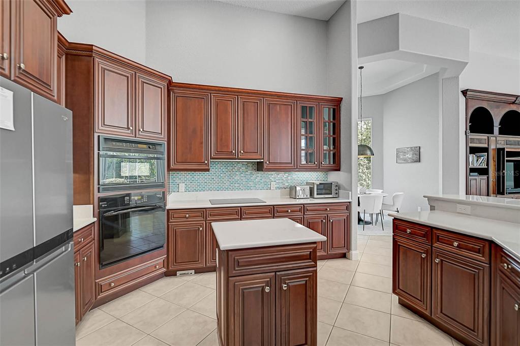 538 Dove Pointe Osprey, FL 34229 - Photo 15 of 74 a kitchen with stainless steel appliances granite countertop a sink stove and refrigerator