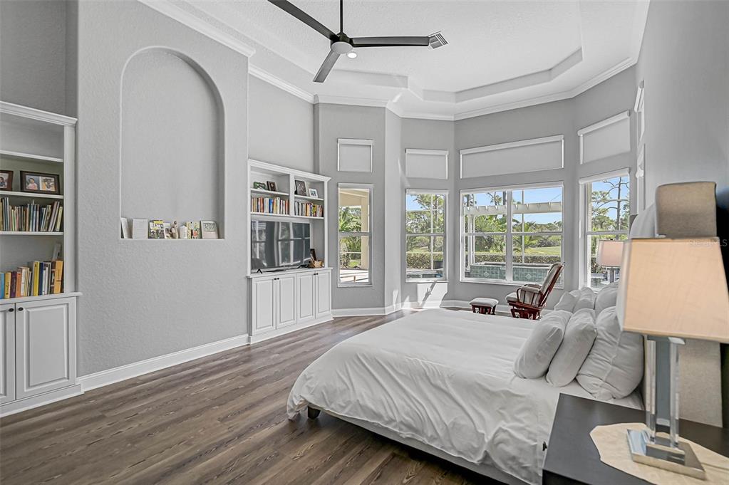 538 Dove Pointe Osprey, FL 34229 - Photo 24 of 74 a spacious bedroom with a large bed and a window