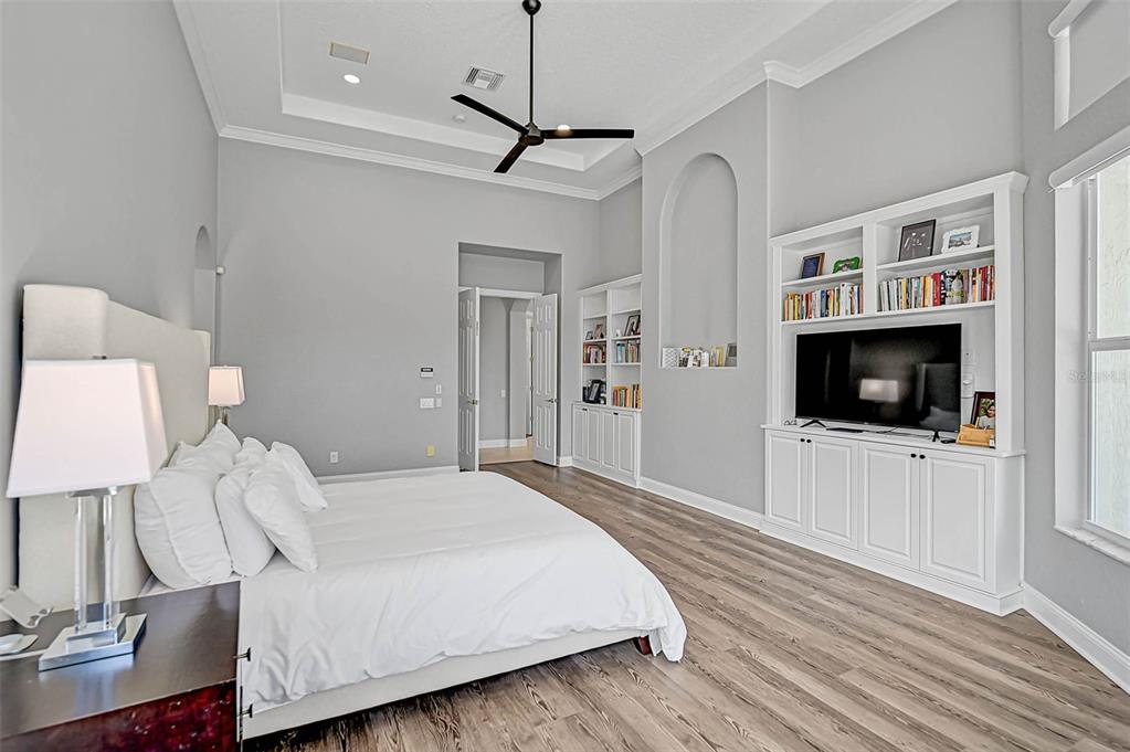 538 Dove Pointe Osprey, FL 34229 - Photo 25 of 74 a bedroom with a bed and a flat screen tv