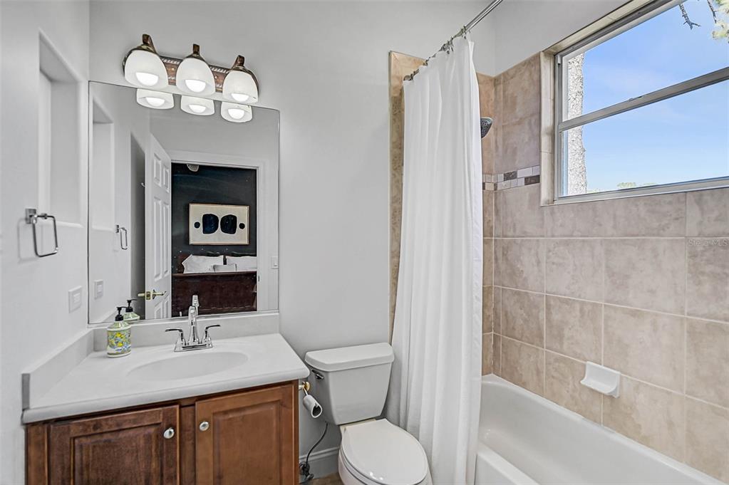 538 Dove Pointe Osprey, FL 34229 - Photo 33 of 74 a bathroom with a sink a toilet and shower