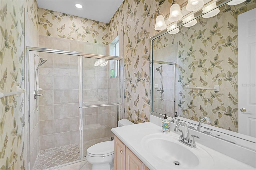 538 Dove Pointe Osprey, FL 34229 - Photo 38 of 74 a bathroom with a sink a toilet and shower