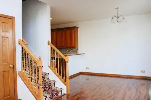 a view of an entryway with wooden floor